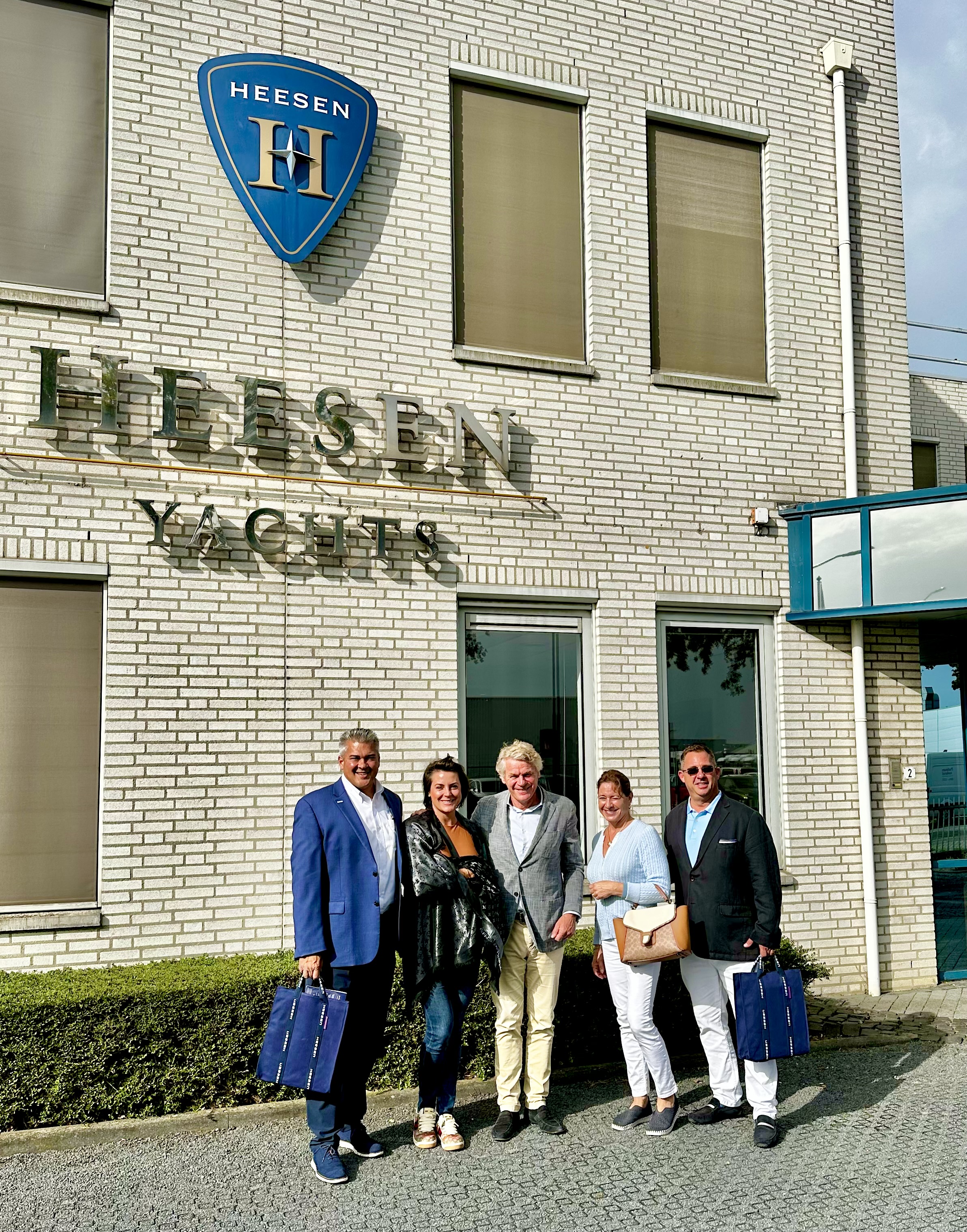 the JFA Yacht and Heesen teams in front of the Heesen factory